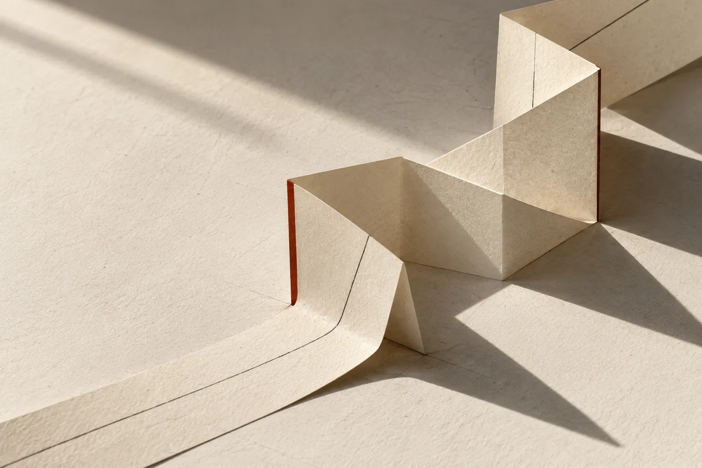 An editorial study of folded ivory paper, graphite guide lines and sculptural shadows.